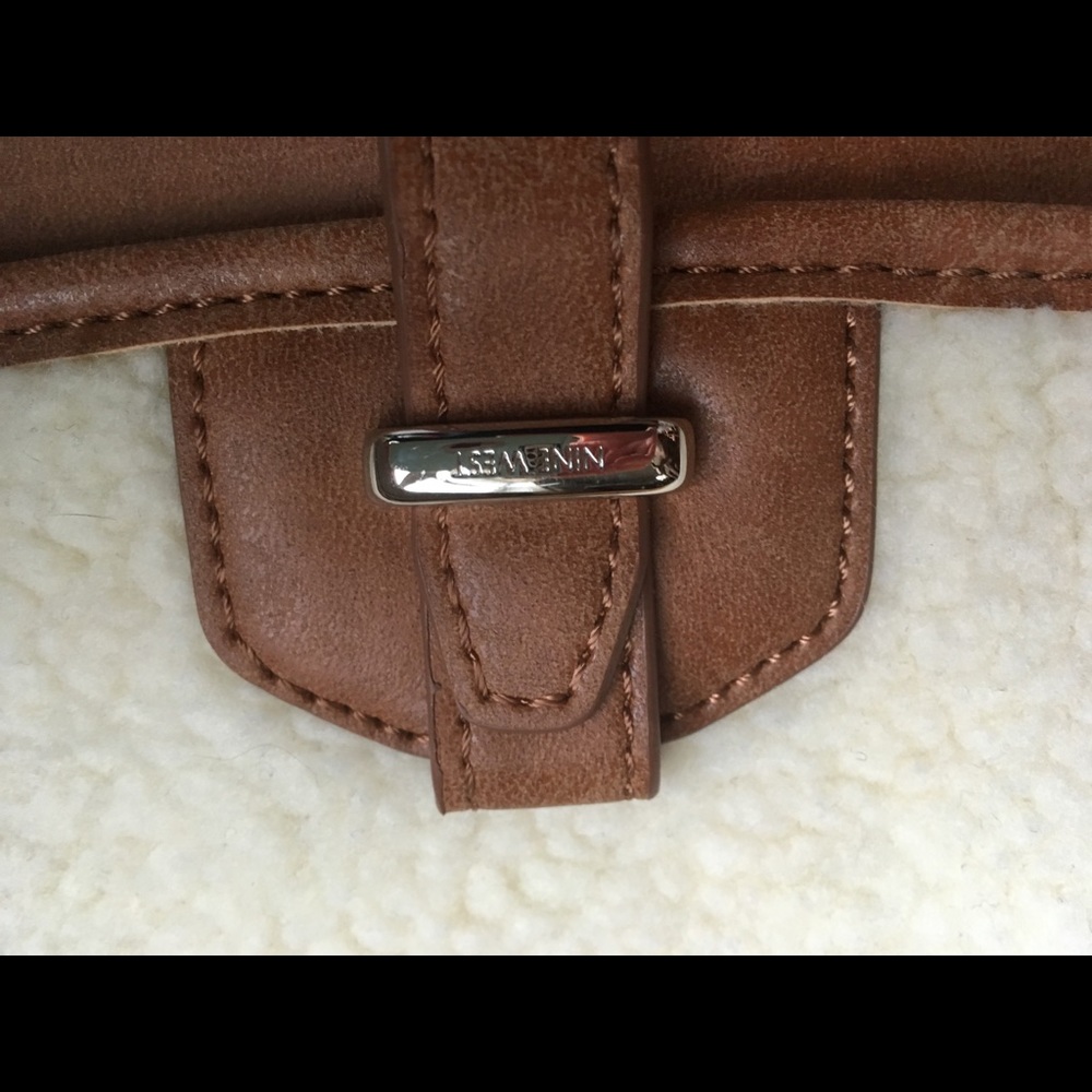 Mid size nine West purse.